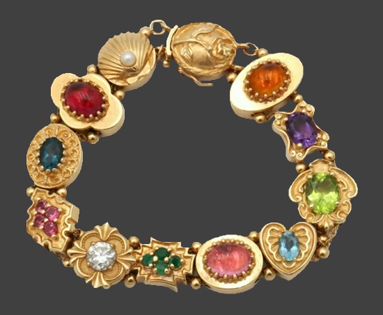 Bracelet. 14 K gold, genuine pearl, cubic zirconia, citrine, sapphires, emeralds and amethyst
