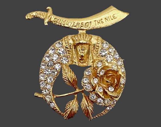 Logo of Shriners International. Daughter of the Nile Masonic Scimitar Face Mask sword rose gold tone rhinestone brooch pin