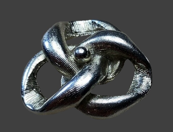 Silver and gold tone shoe clip