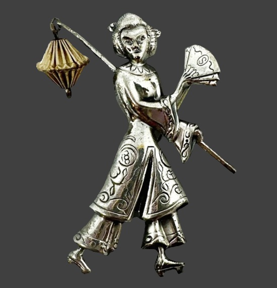 Asian girl holding lantern and fan