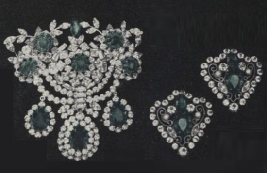 Vogue 1950s ad. Faux emerald pin and clip earrings