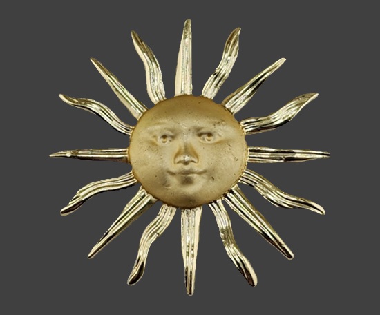 Sun face gold tone brooch, 1980s