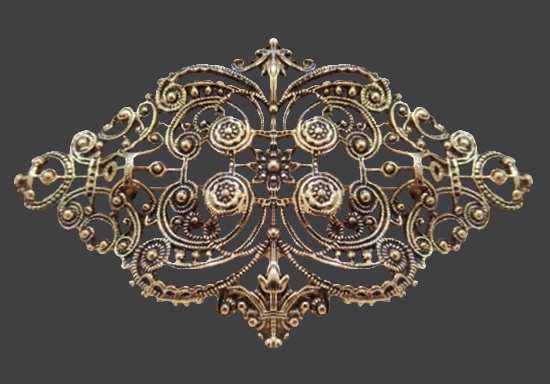 Antique look filigree gold tone brooch