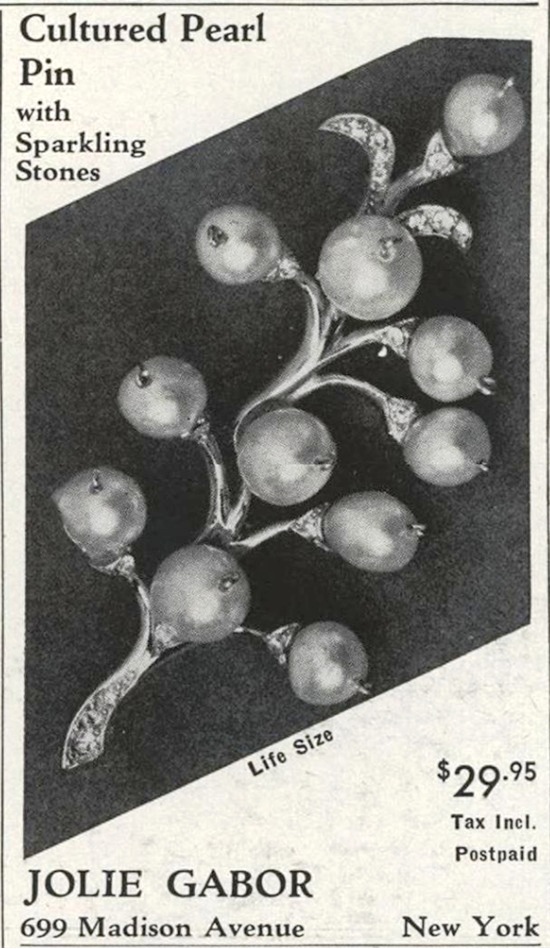 Cultured pearl pin with sparkling stones, Vogue November 1952 ad