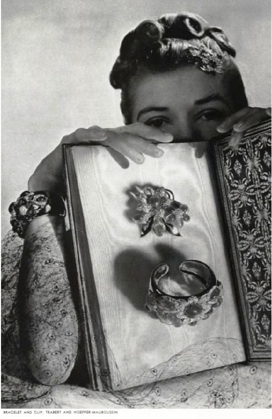 Emerald brooch and bracelet,Vogue December 1938 ad