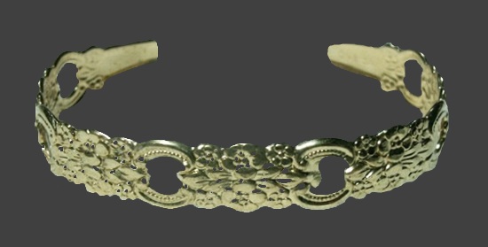 Gold tone floral pattern cuff bracelet
