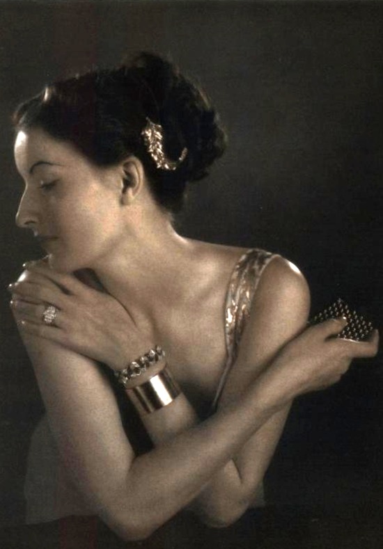 Gold with diamonds - barrel ring, celery-leaf clip, link bracelet, gold band bracelet, Vogue October 1937 ad
