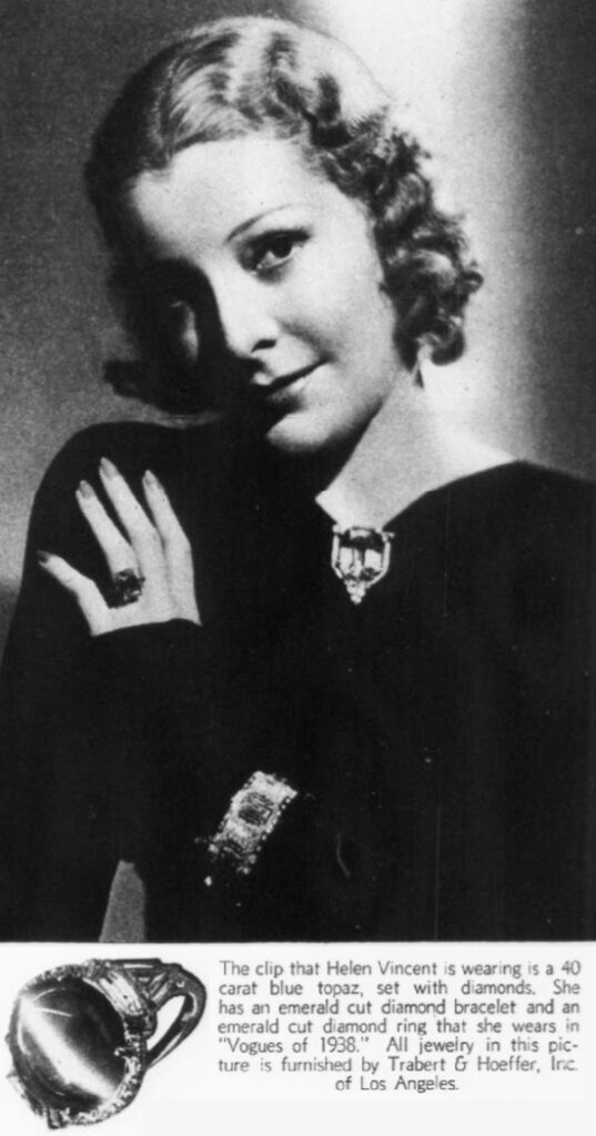 Helen Vincent wearing 40 carat blue topaz, set with diamonds, emerald cut diamond bracelet and an emerald cut diamond ring by Trabert & Hoeffer, September 1937