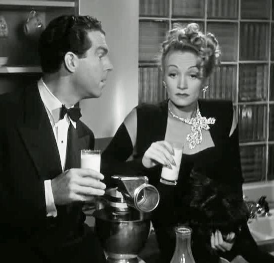 Marlene Dietrich wearing a peacock feather necklace by Paul Flato in The Lady Is Willing, 1942
