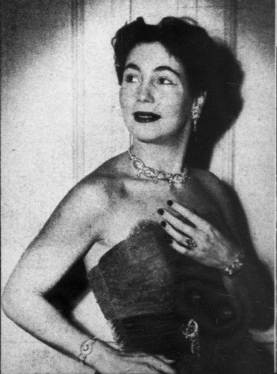 Peggy Wright wears an unusual set of necklace, corsage brooch and earrings set off with 'trailers' of pear-shapes or marquise stones. 1951 ad