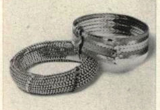Preciously jewelled bracelets with watches in little hidden compartments. 18 K gold, with a diamond-edged clasp; $1,000, Vogue September 1956