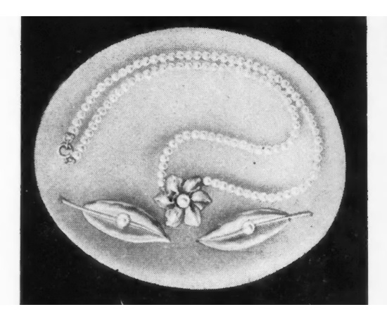Starlet Simulated pearl necklace and leaf barrettes. 1951 ad