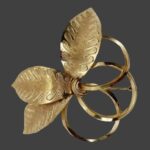 Triple leaf gold tone pin brooch